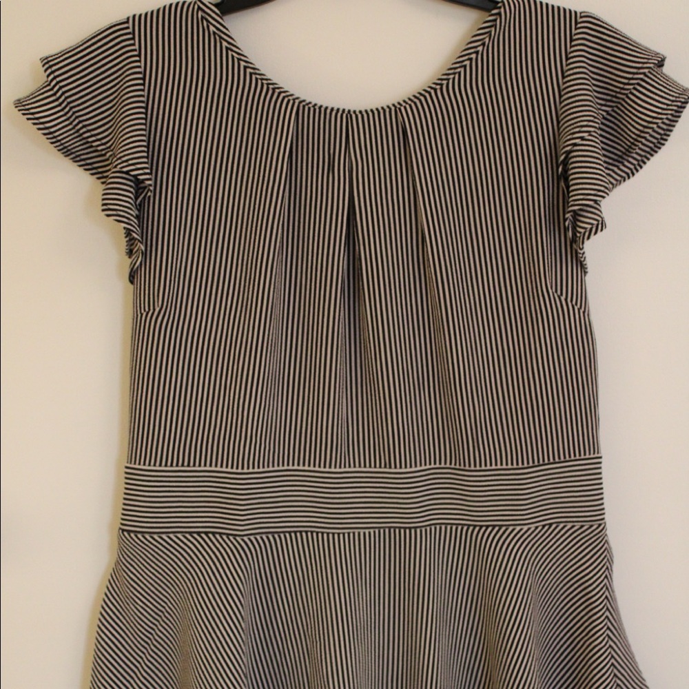 Black and white striped blouse. Flutter sleeves and skirted waist.